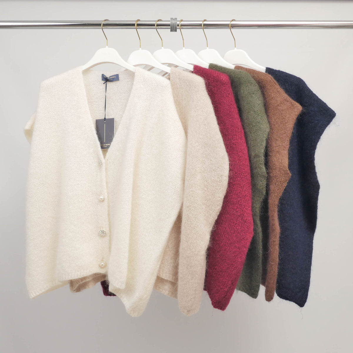 Sleeveless fluffy knit vest with jeweled buttons   mcl24002