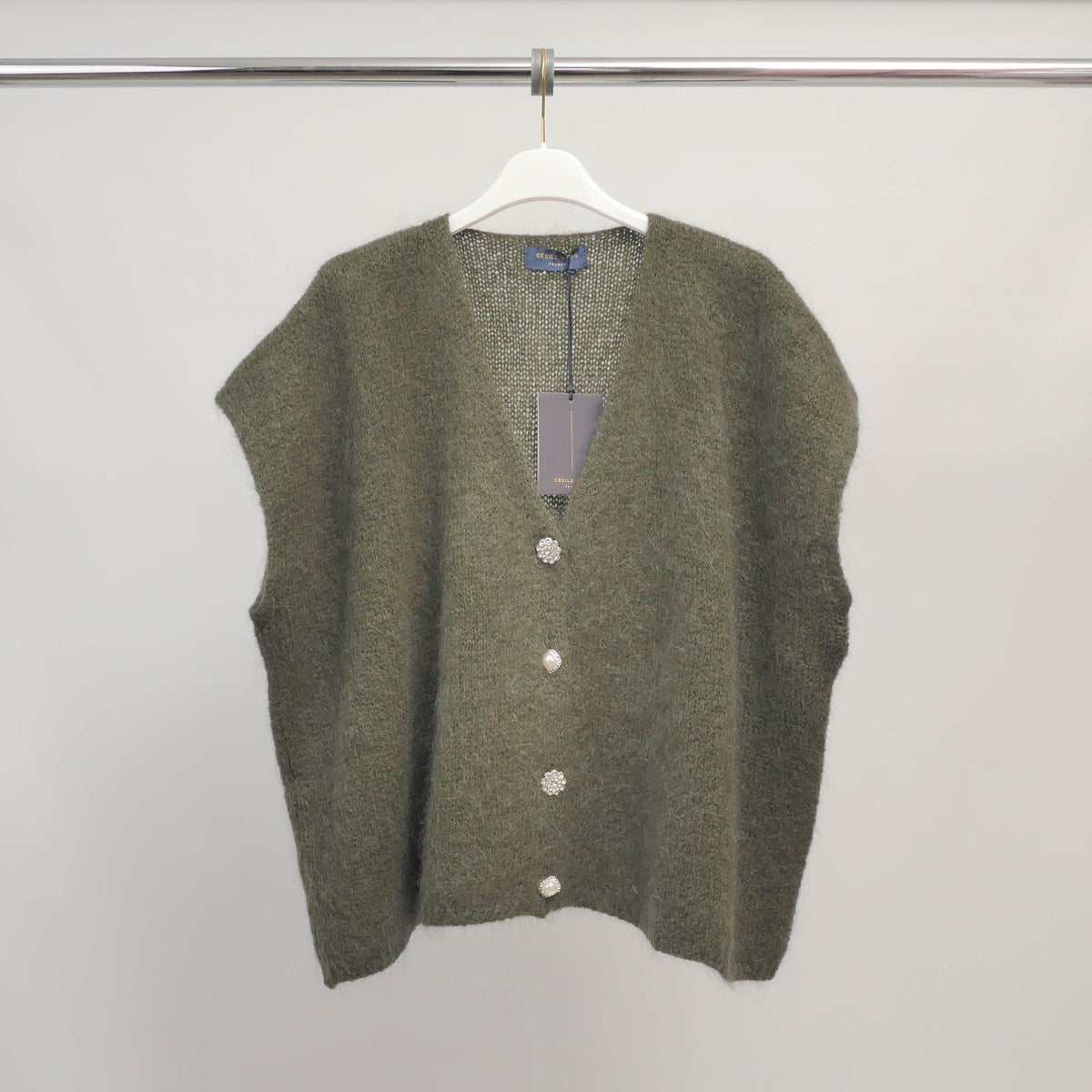 Sleeveless fluffy knit vest with jeweled buttons   mcl24002